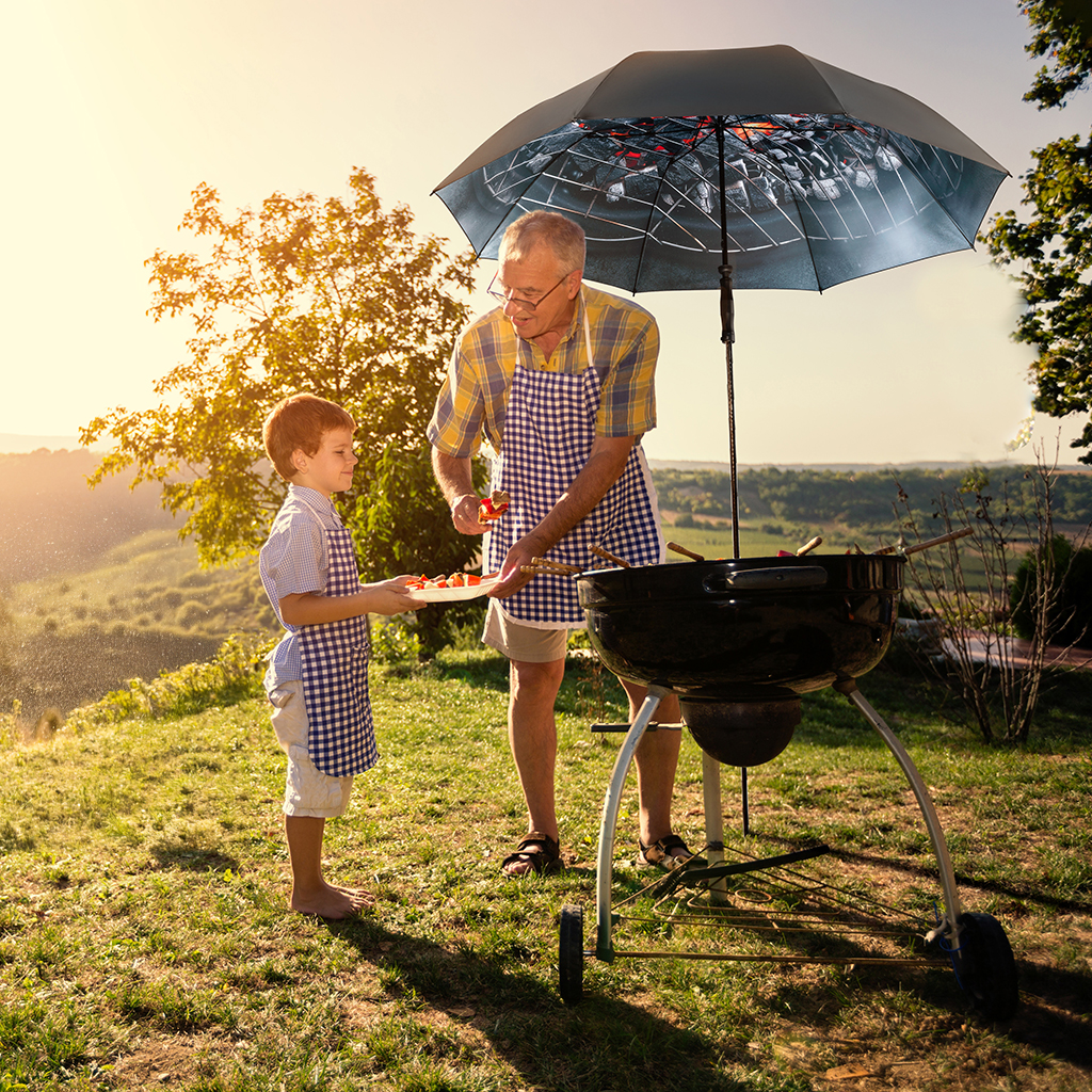 Family barbecue under a parasol Travelmate Camper