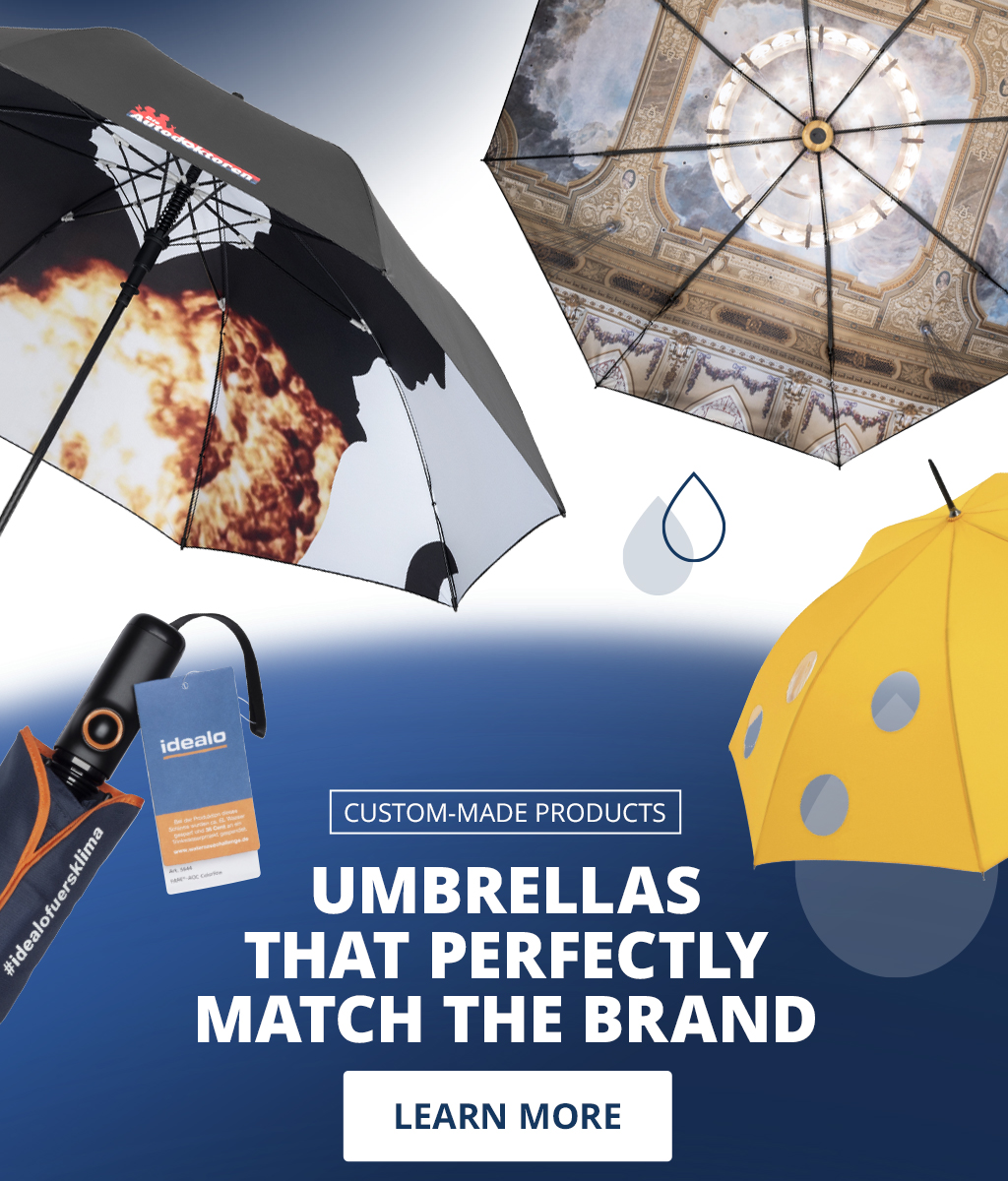 Banner for custom designs: Various individually designed umbrellas, including a yellow polka dot umbrella, a black logo umbrella, and an umbrella with a church motif. Text: 'Custom designs – Ensuring the umbrella perfectly matches the brand – Learn more